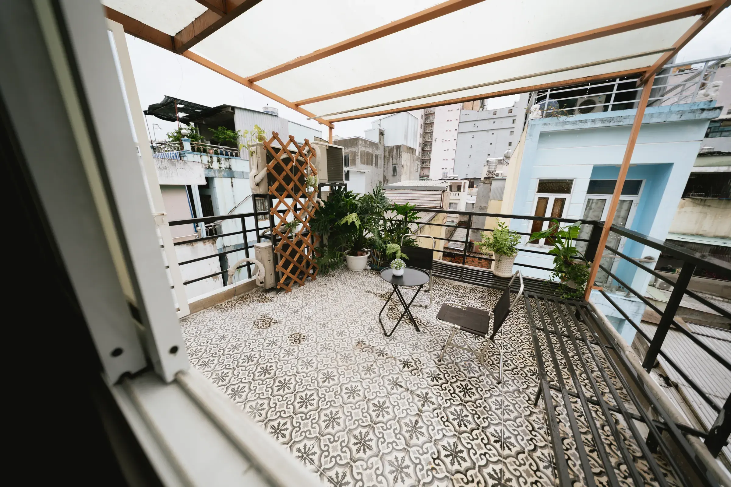 The rooftop with patterned tiles and plants