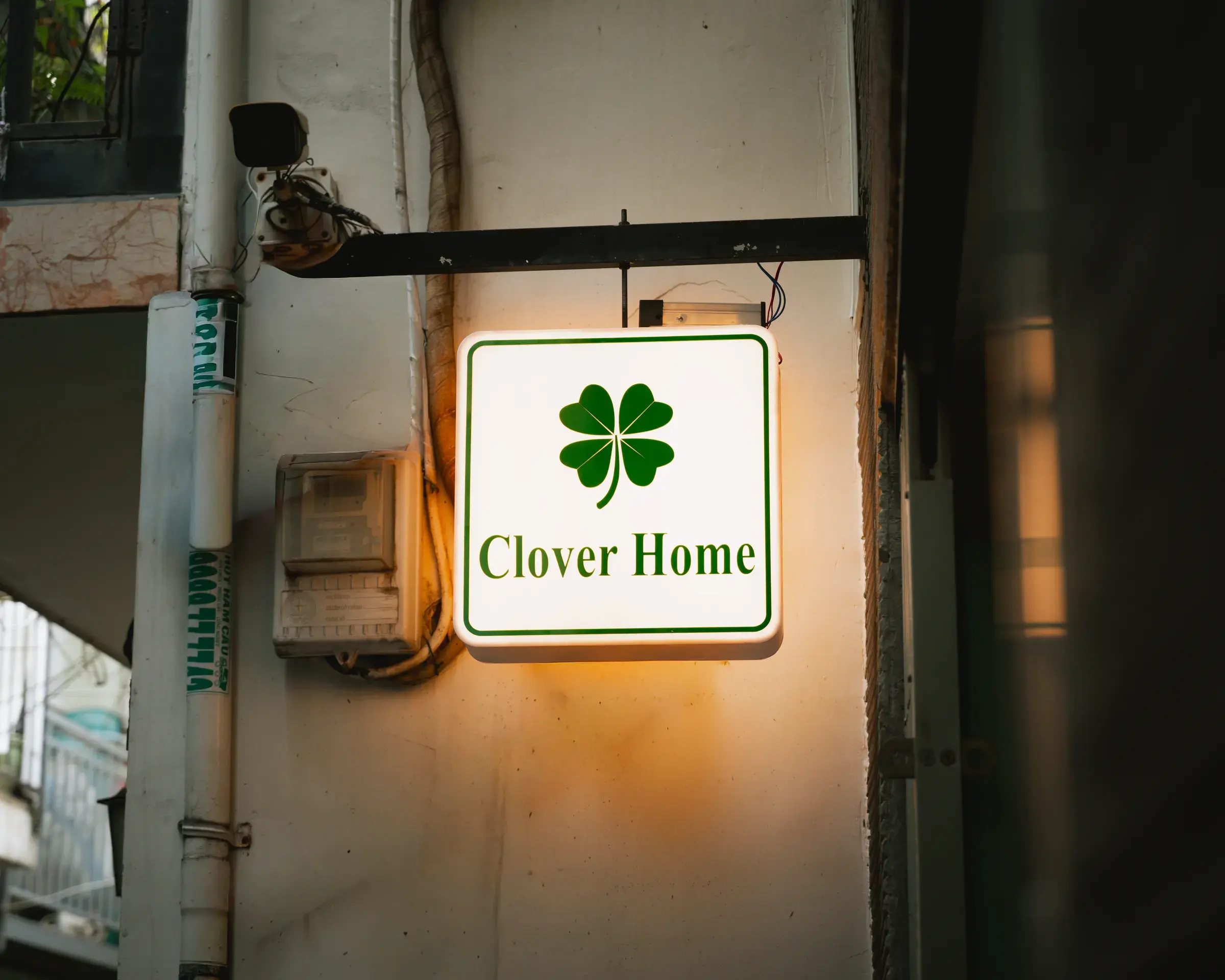 The lobby and the green Clover Home sign